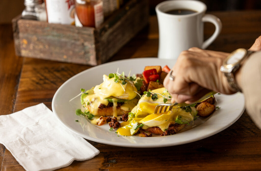The Boarder Benedict with chorizo, onions, avocado on an English muffin with Hollandaise sauce from the Verano Cafe Thursday, June 13, 2024 in Sonoma. (Photo by John Burgess/The Press Democrat)