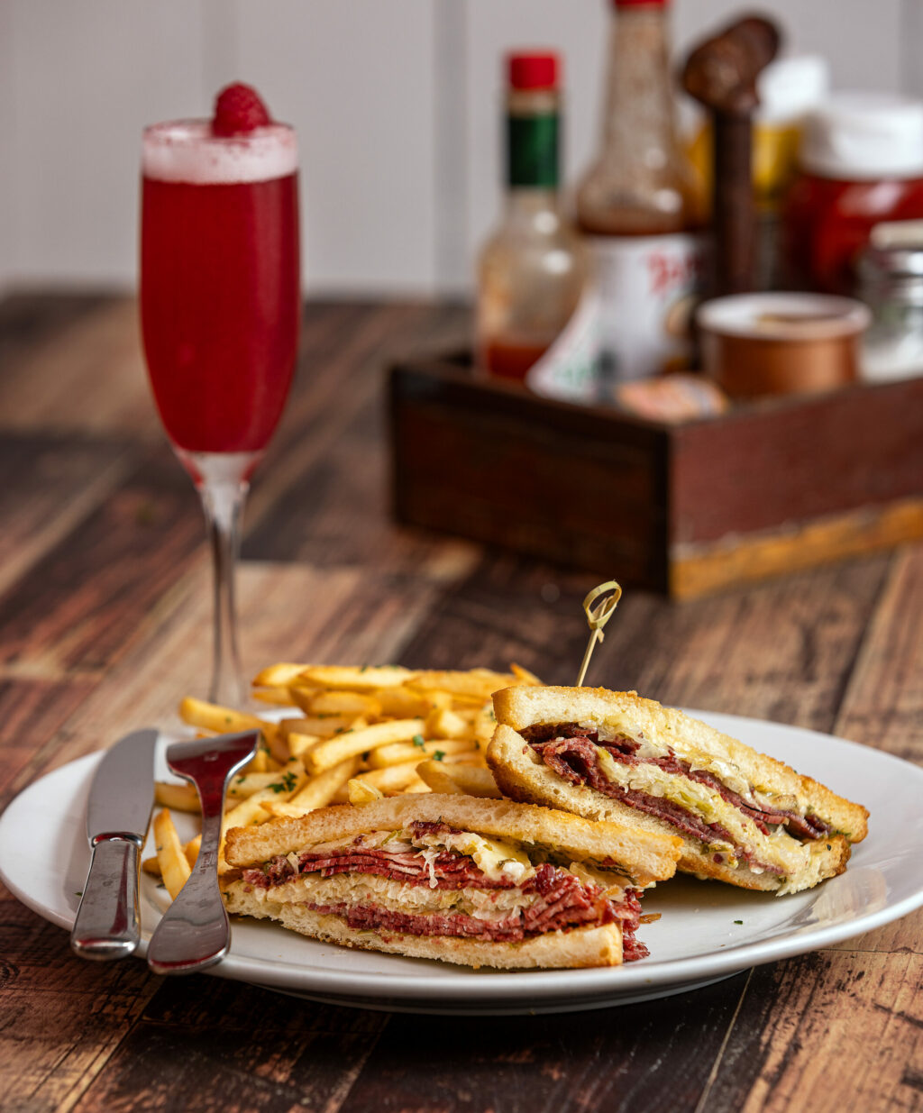 The Rueben Sandwich with fries and and passion fruit mimosa from the Verano Cafe Thursday, June 13, 2024 in Sonoma. (Photo by John Burgess/The Press Democrat)
