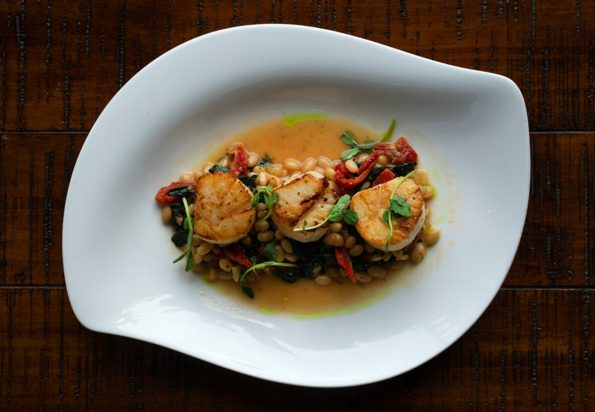 Roasted Diver Scallops with Òharicot cocoÒ beans, dried tomatoes, garden kale,roasted garlic, lemon, parsley and herb oil from John Ash & Co. in Santa Rosa. (photo by John Burgess/The Press Democrat)