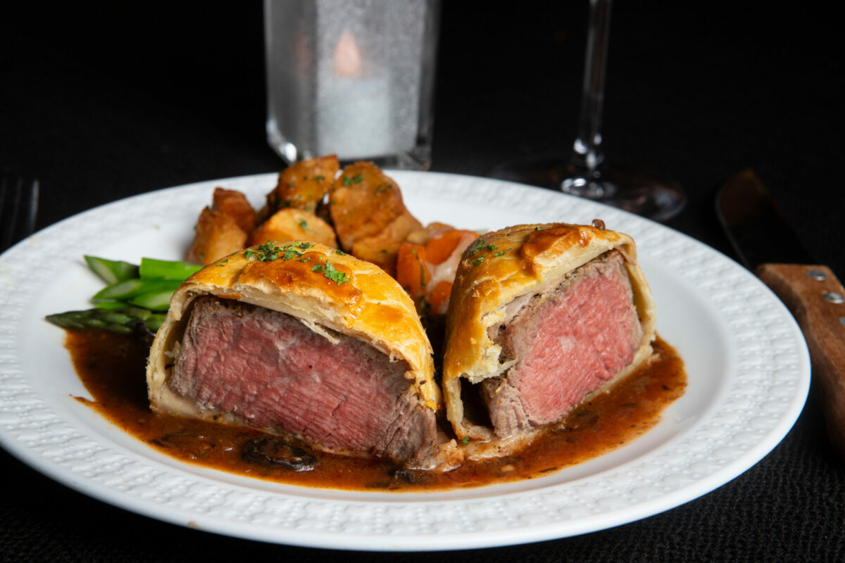 Filet de Boeuf Wellington, tenderloin of beef en croute with duxelle and Madeira sauce, a specialty of the house is shown at La Gare French Restaurant, in Santa Rosa, on Friday, July 5, 2024. (Darryl Bush / For The Press Democrat)