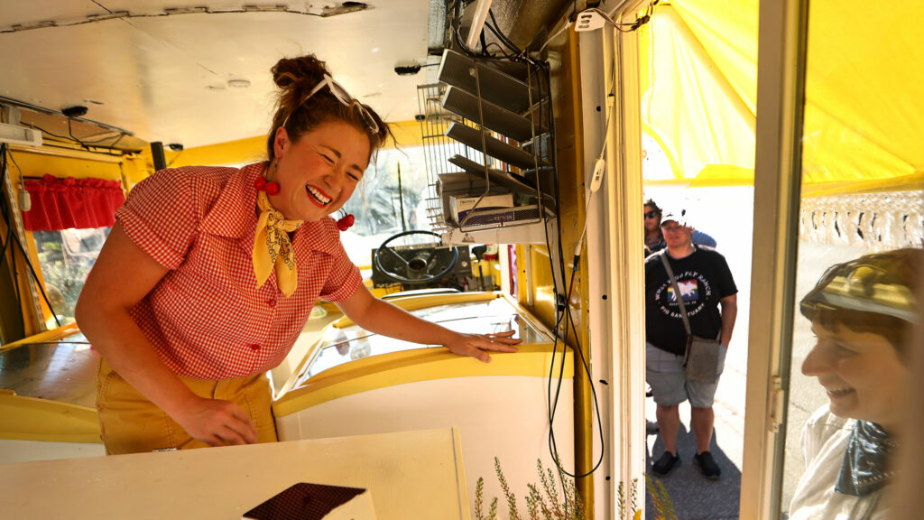 Anamaria Morales, the College Confectionista, lets good emotions out, Tuesday, July 30, 2024, at her pop-up mobile cheesecake truck in downtown Guerneville, Tuesday, July 30, 2024. (Kent Porter / The Press Democrat) 2024