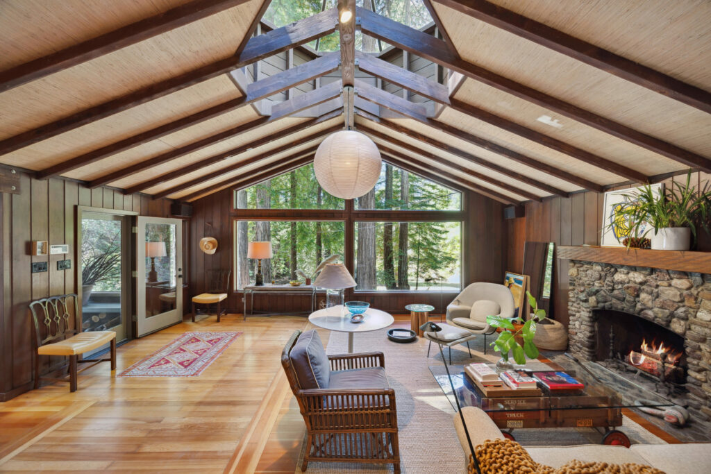 The great room has ample light thanks to large windows and a cupola. (Open Homes Photography)