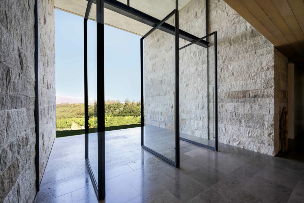Pivoting doors connecting to the outdoors. (Robert Vente / Sotheby's International Realty)