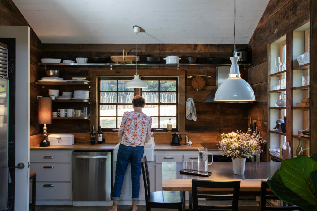 Reclaimed redwood siding extends into the rustic farm kitchen. (Eileen Roche/Sonoma Magazine)