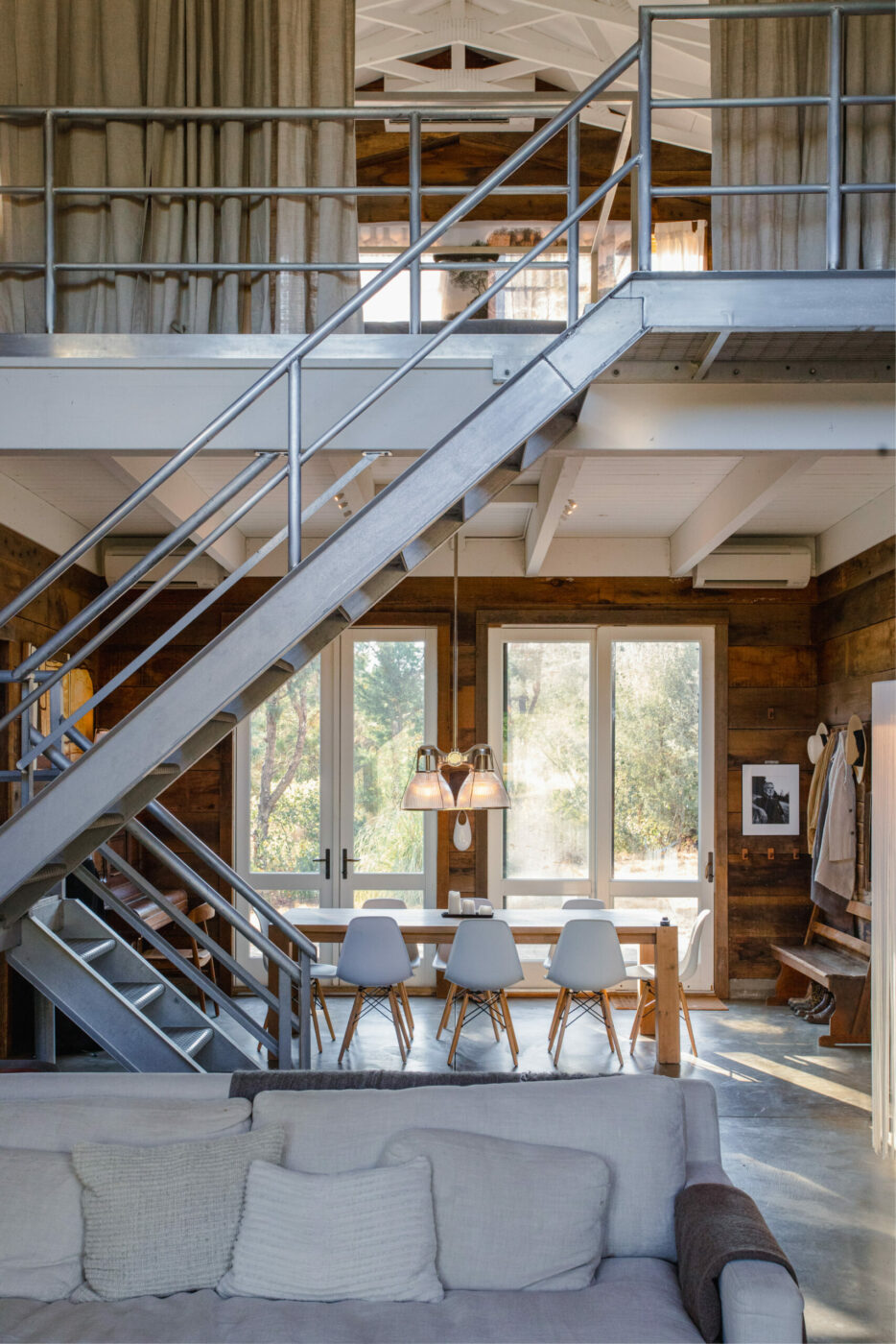 Stainless steel winery scaffolding leads to the upstairs sleeping space. (Eileen Roche/Sonoma Magazine)