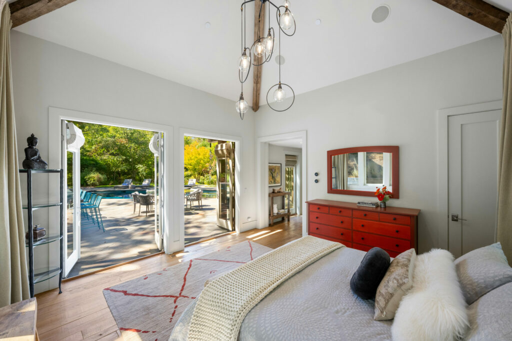 Bedroom with French doors opening to the patio. (Sea Timber Media)