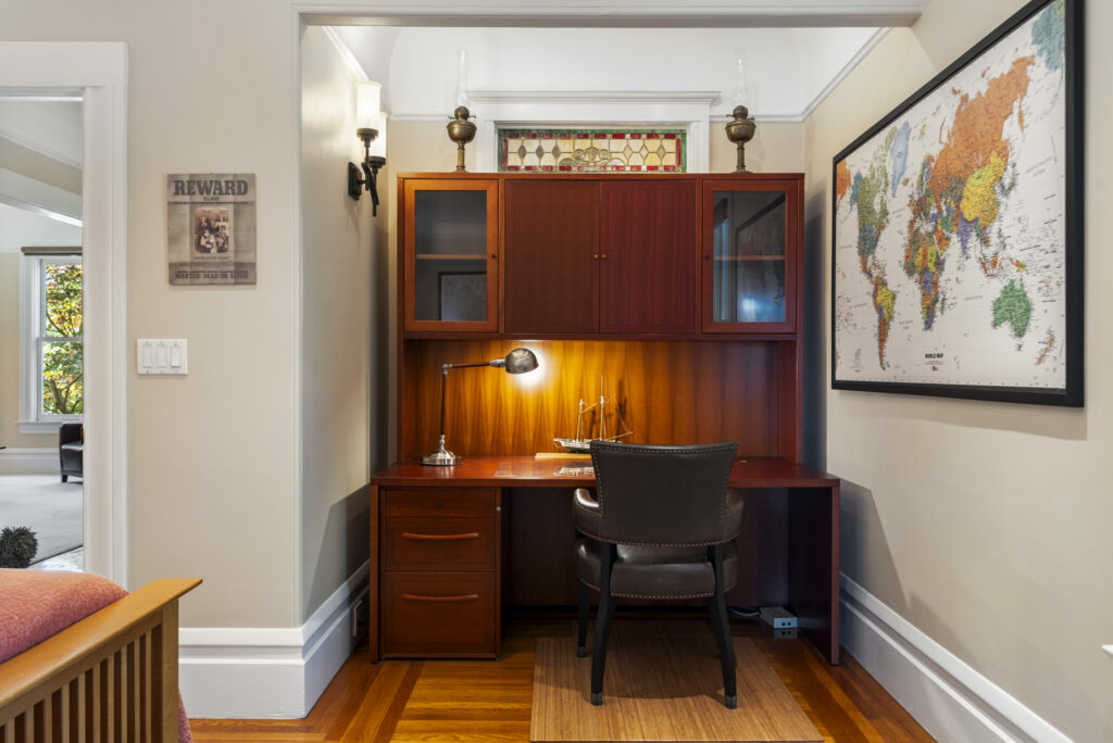 The home’s vintage details include this stained glass transom window. (Rob Sullivan)