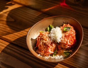 Nonna’s Meatballs made with beef, pork, pistachios and raisins then topped with marinara and ricotta from Campanella Friday, September 6, 2024 in Sebastopol. (John Burgess / The Press Democrat)