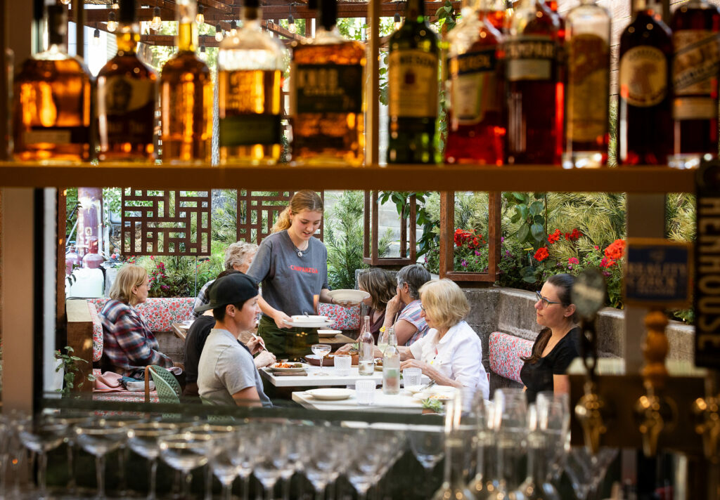 The view from the bar into the garden patio at Campanella Friday, September 6, 2024 in Sebastopol. (John Burgess / The Press Democrat)