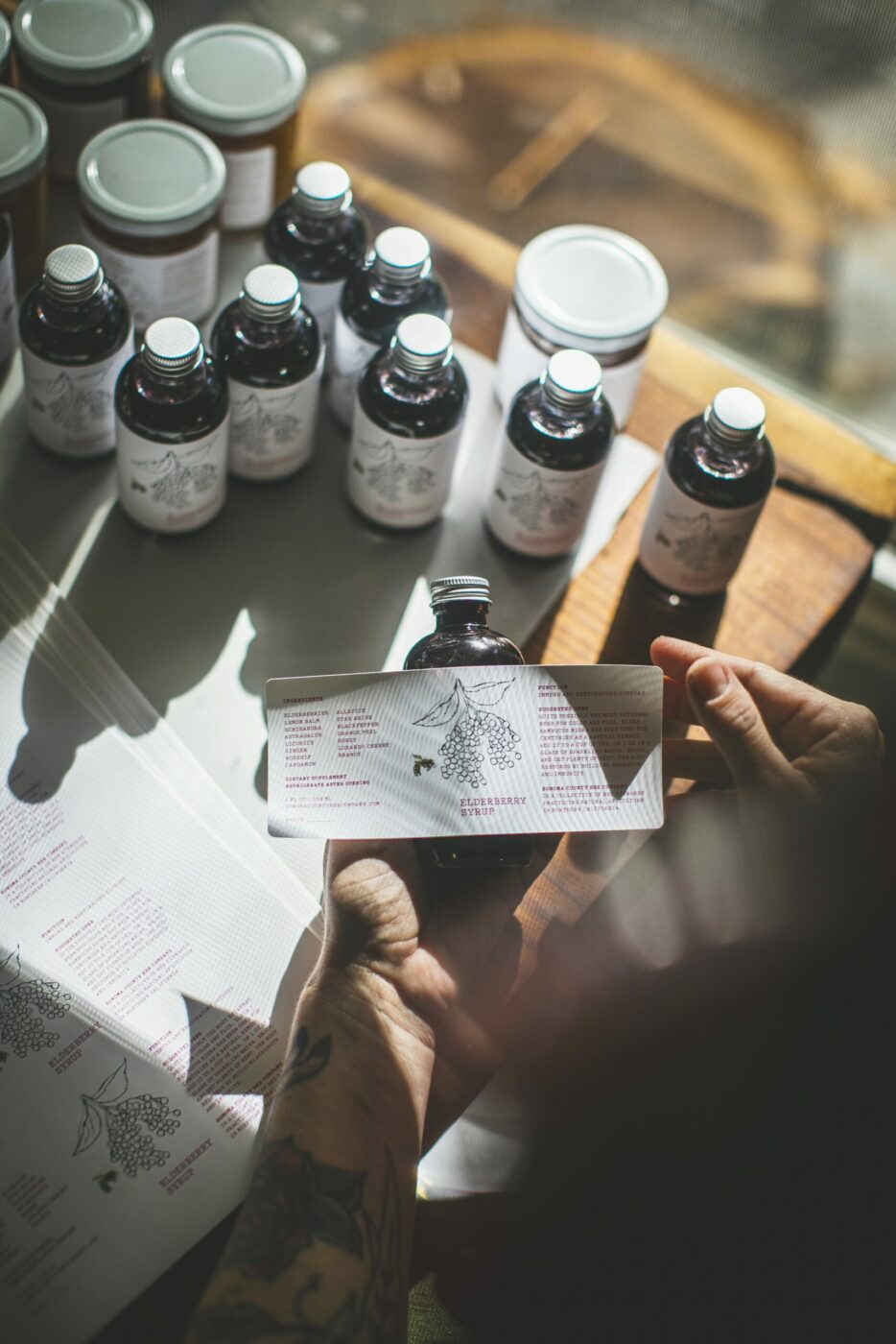 Labeling jars of honey. (Bryan Meltz/Sonoma Magazine)