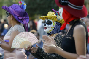 Dancers perform in front of a crowd during the Dia de los Muertos celebration at the Healdsburg Plaza on Sunday, October 29, 2017, in Healdsburg. (BETH SCHLANKER/The Press Democrat)