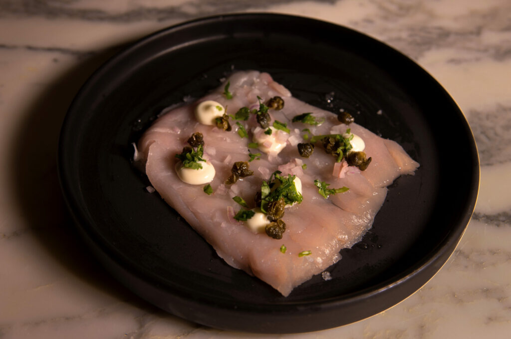Local Albacore Carpaccio with Crispy Capers, Yuzu Aioli, and Chives at Oyster, a new restaurant in The Barlow, Monday, November 7, 2022, in Sebastopol. (Darryl Bush / For The Press Democrat)