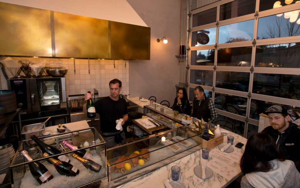 Chef Jake Rand serves guests at Oyster, a new restaurant in The Barlow, Monday, November 7, 2022, in Sebastopol. (Darryl Bush / For The Press Democrat)
