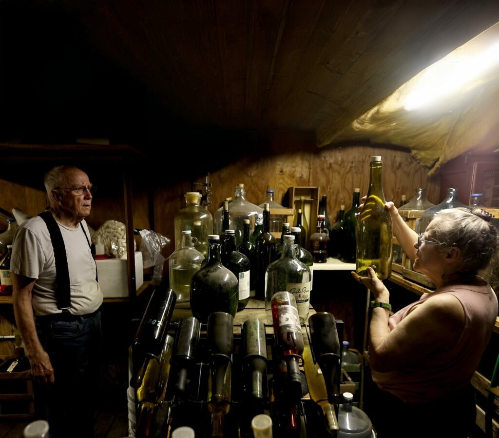 Longtime club officer Doug Ghiselin, left, with Rebecca Kreeger at Ghiselin's home wine cellar in Sonoma. (Kent Porter/The Press Democrat) 