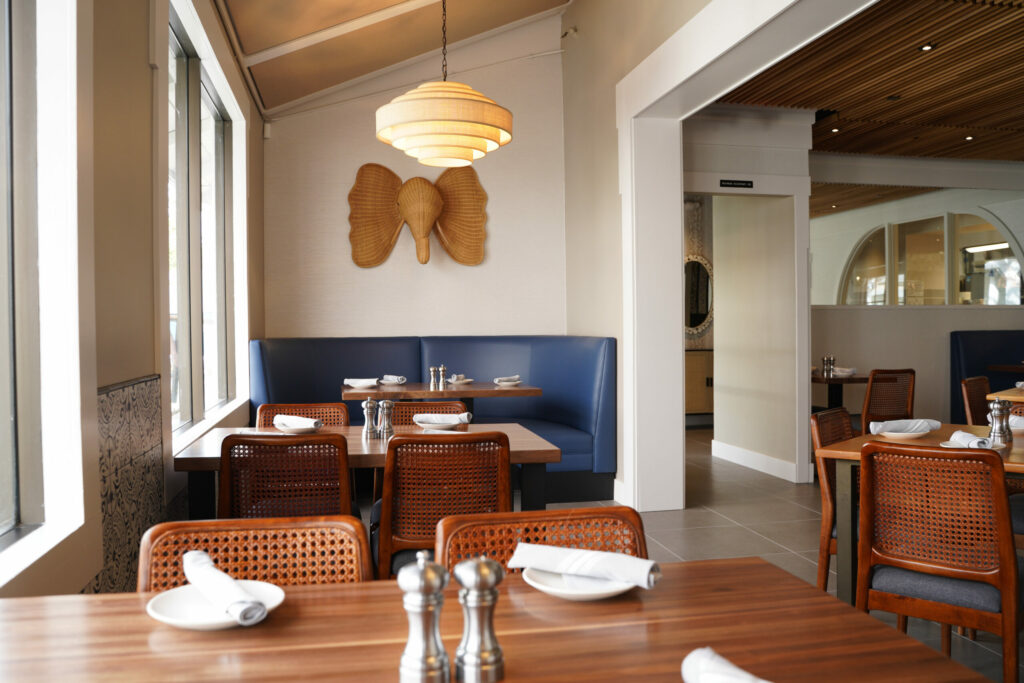 The newly renovated dining room at Monti's Restaurant in Montgomery Village. The space, according to co-owner Terri Stark, is lighter and more modern with Mediterranean blue and rattan accents. (Courtesy of Monti's)