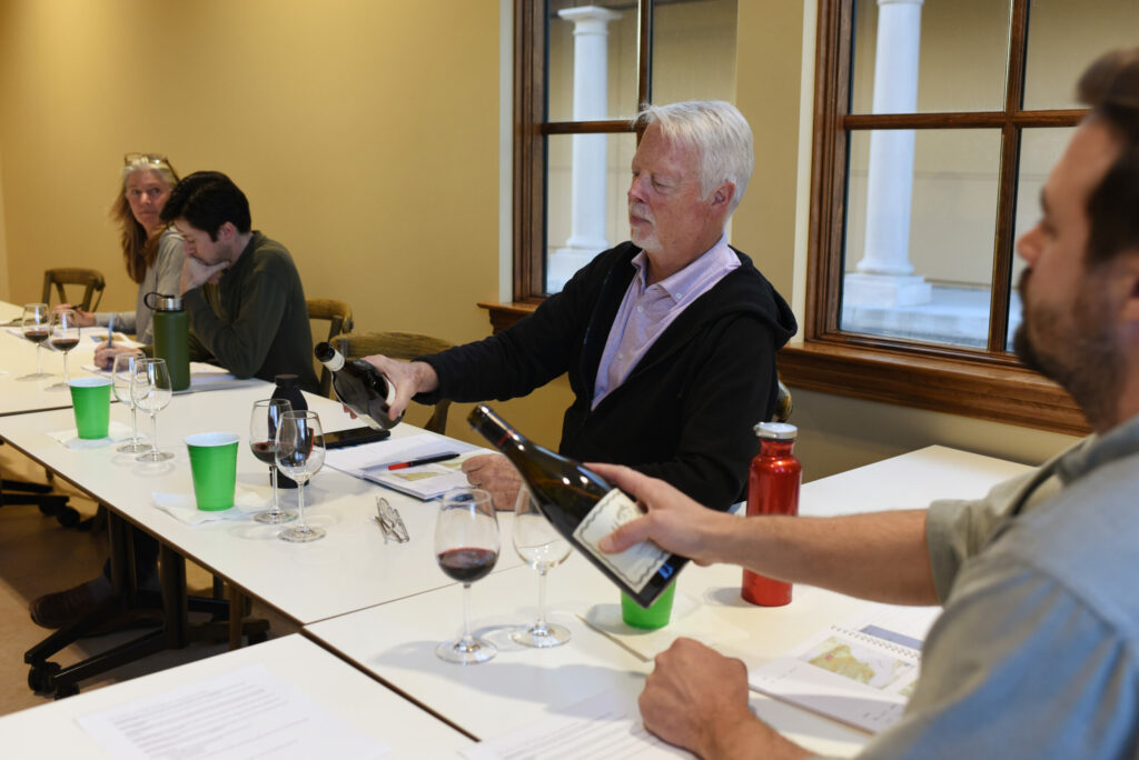 "I love wine and I wanted a more structured approach to describing why I like wine," said retiree and Healdsburg resident Doug Garrett, second from right, during a wine education class at the Odyssey Wine Academy held at Bacchus Landing in Healdsburg, Tuesday, March 15, 2022. (Erik Castro/for The Press Democrat)
