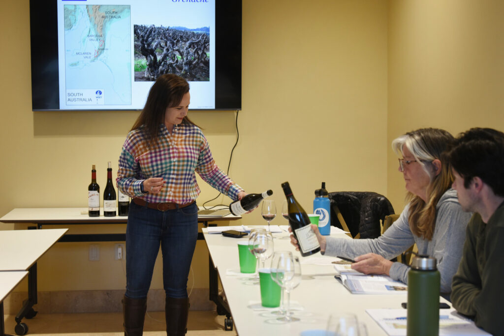 Julie Rothberg, left, president of Medlock Ames winery, during a wine education class focusing on a few varietals from France and Spain at the Odyssey Wine Academy founded by Rothberg and held at Bacchus Landing in Healdsburg, Tuesday, March 15, 2022. (Erik Castro/for The Press Democrat)