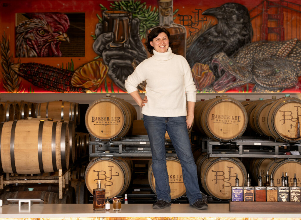 Lorraine Barber, co-owner of Barber Lee Spirits, in their barrel/tasting room in downtown Petaluma Thursday, October 11, 2024. (John Burgess / The Press Democrat)