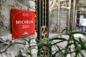 Eze, France - April 21, 2022: Details with a 2 Michelin stars restaurant sign. (Mircea Moira/Shutterstock)