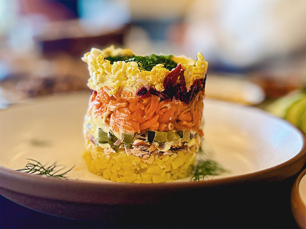 Seven-layer dip, also known as “Under a Fur Coat” salad, at Mable's restaurant at the Lodge at Marconi in Marshall. The dip includes potatoes, smoked trout, pickles, carrots, beets and aioli. (Courtesy Oliver Hospitality)