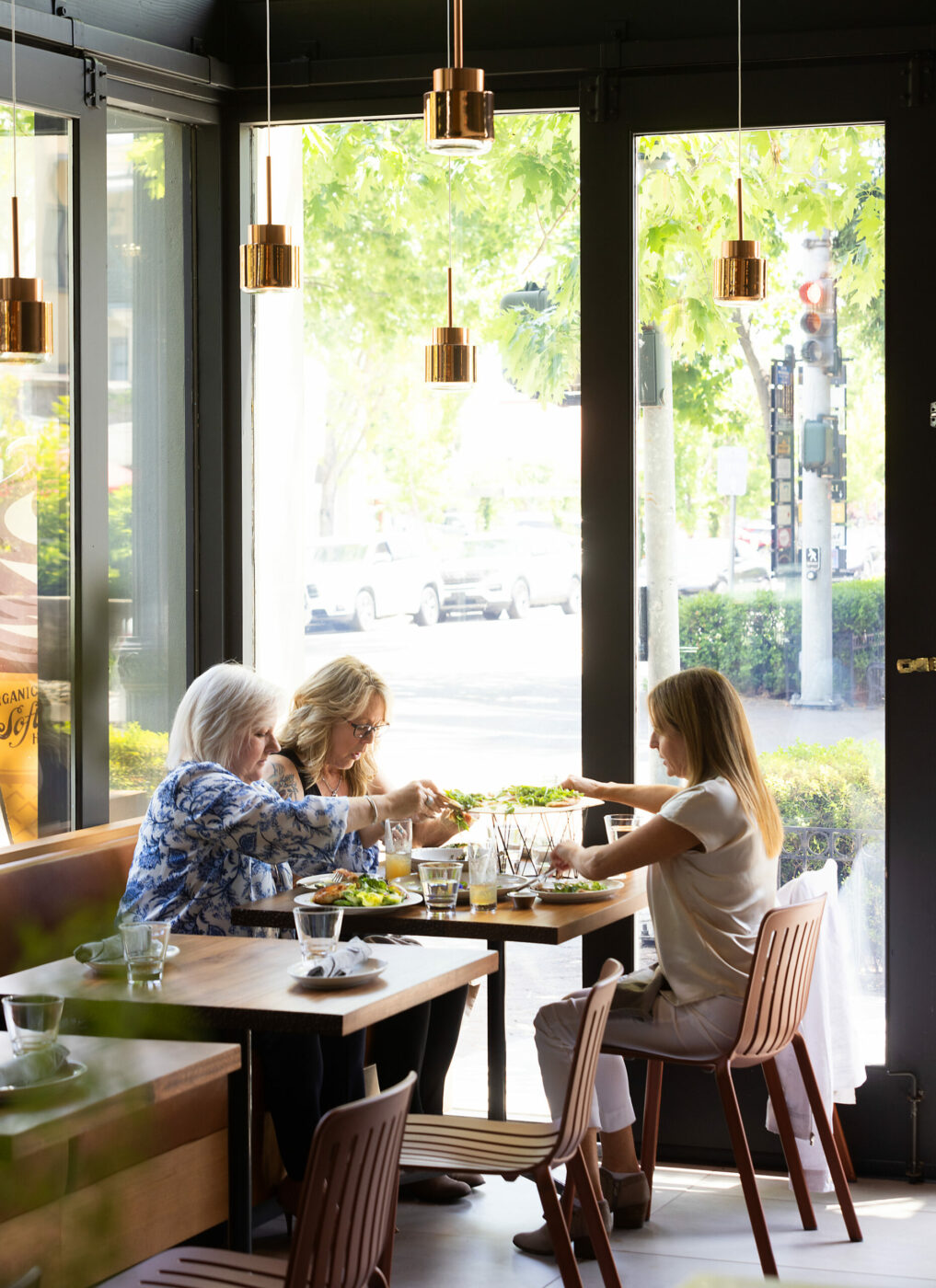 From left, Lori Taylor, Phyllis Sutton and Tracy Garrison grab a pizza for lunch from Pizzando on a day out in Healdsburg, Friday, June 2, 2023. (John Burgess / The Press Democrat)