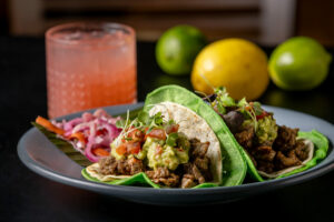 Tacos al Carbon with carne asada, a double tortilla with melted cheese in between, sour cream, guacamole & pico de gallo from El Milagro Healdsburg, a block west of the square Friday, Nov. 1, 2024, in downtown Healdsburg. (John Burgess / The Press Democrat)