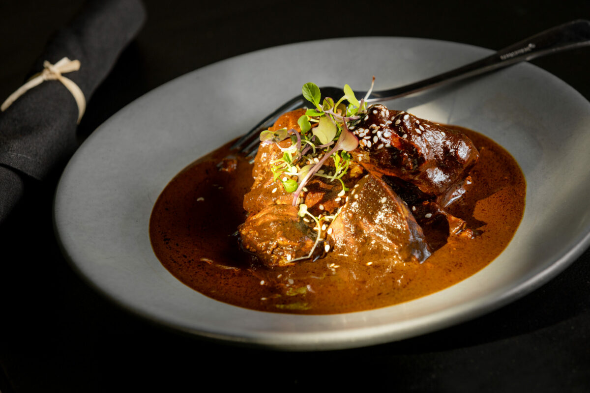 Traditional pre-Hispanic Mole Rojo with a mix of spices perfected by co-owner Julio Velazquez’s mom from El Milagro Healdsburg, a block west of the square Friday, Nov. 1, 2024, in downtown Healdsburg. (John Burgess / The Press Democrat)