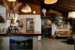 The family room is lit by pendants crafted by Morgania Moore. Furniture and art are thrifted or made, or were gifts from friends. (Eileen Roche / Sonoma Magazine)