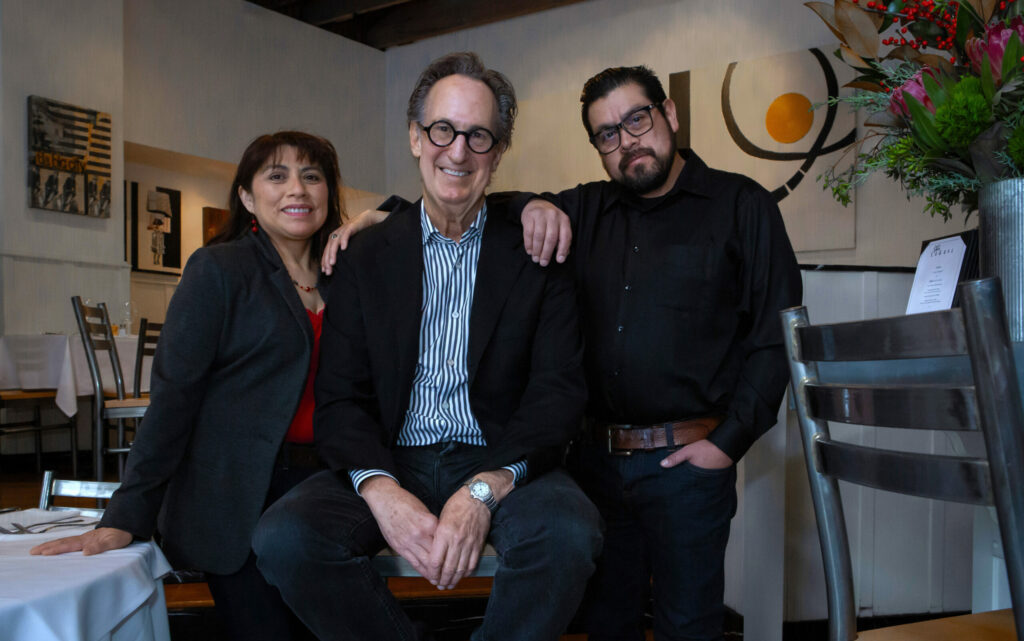 Cafe La Haye owner Saul Gropman, center, is selling his well-known Sonoma restaurant to José and Marta López-Nuñes. Photo taken at the restaurant on East Napa Street on Thursday, Dec. 12, 2024. (Robbi Pengelly / The Sonoma Index-Tribune)