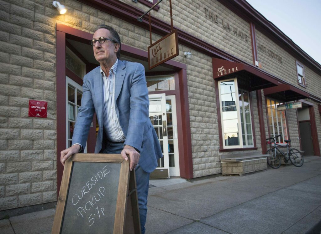 Saul Gropman, proprietor of the Cafe La Haye restaurant on East Napa St., sold over seventy meals, for curbside pickup only, on Saturday, March 21. Many restaurants around town now offer this service. (Photo by Robbi Pengelly/Index-Tribune)