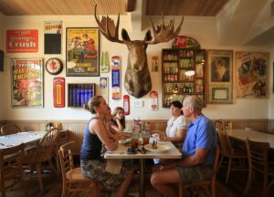 Amy Knudsen, left, Kurt Hauser, right, with Ella Brait, Hannah Knudsen Robyn DeuPree (from left, clockwise), eat at Hopland's Bluebird Cafe on Wednesday, June 21, 2017. (Kent Porter/The Press Democrat)