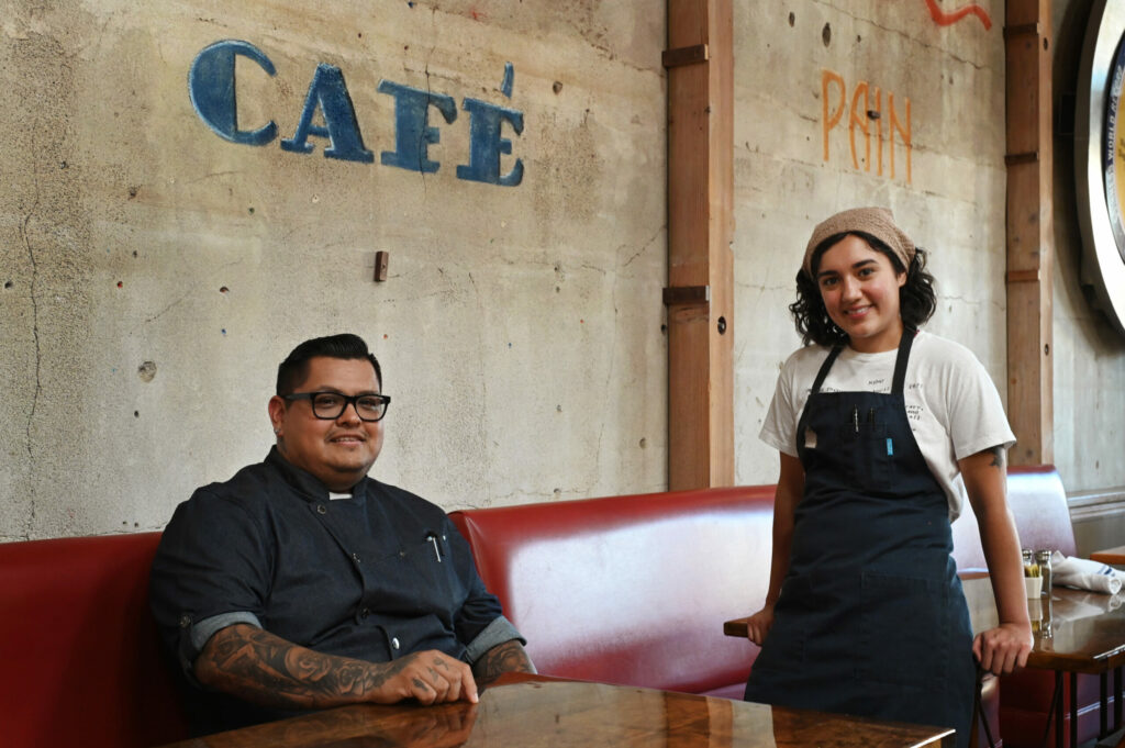 Chef Jorge Flores, left, who was executive chef at Campo Fina, currently runs the kitchen with sous chef Isabella Cafferata at Costeaux French Bakery, which is now offering classic French bistro menu items on the patio on Tuesdays and Wednesdays evening from 4-8pm at their cafe in Healdsburg on Wednesday, July 31, 2024. (Erik Castro / For The Press Democrat)