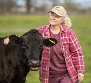 Sylvia Tucker visits with Matilda at Joe Matos Cheese and Farmstead Co. After selling their remaining cheese inventory, the 45-year-old cheesemaking operation will officially close Jan. 31. Wednesday January 29, 2025. (Chad Surmick / The Press Democrat)