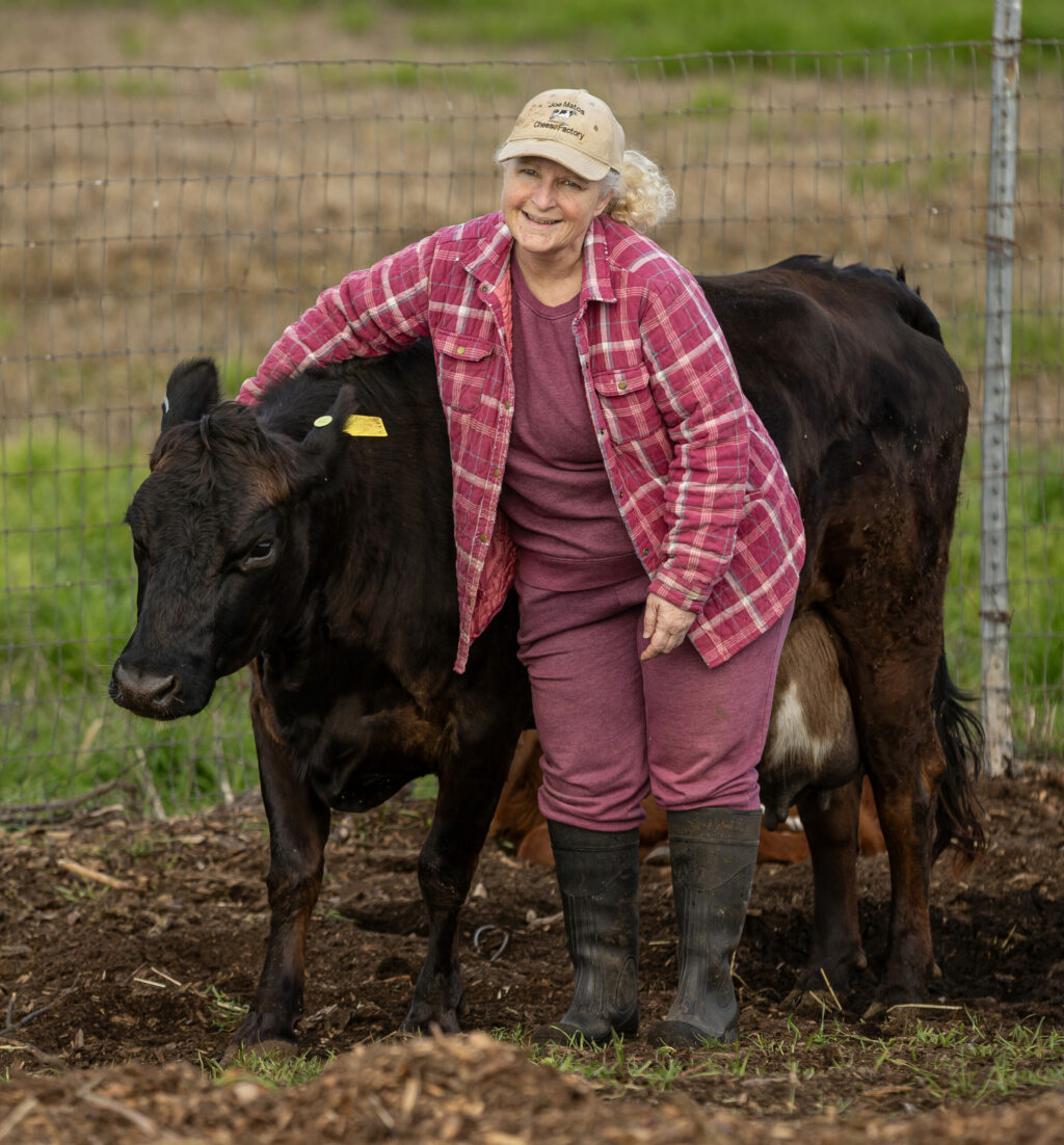Sylvia Tucker visits with Matilda at Joe Matos Cheese and Farmstead Co. After selling their remaining cheese inventory, the 45-year-old cheesemaking operation will officially close Jan. 31. Wednesday January 29, 2025. (Chad Surmick / The Press Democrat)