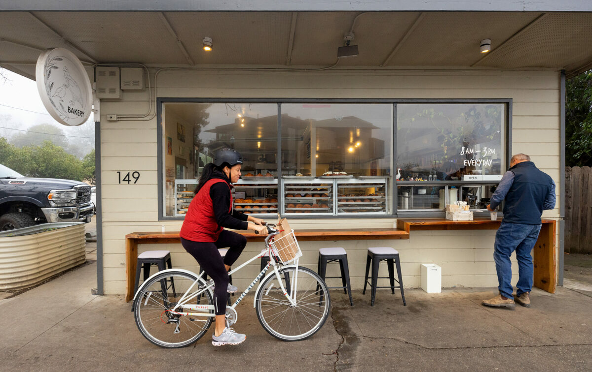 Erynn Faucett of Sacramento borrowed a bike from her hotel to try the Quail & Condor bakery, one of the best bakeries in the U.S. according to the New York Times Monday, Jan. 6, 2025, in Healdsburg. (John Burgess / The Press Democrat)
