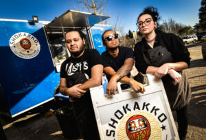 The owners of Shokakko, an Asian street food truck, from left, Elijah Trujillo, Kazuya Makishima and Kayla Hendrix, Jan. 23, 2025 on their Thursday night at Old Caz Beer in Rohnert Park. (John Burgess / The Press Democrat)