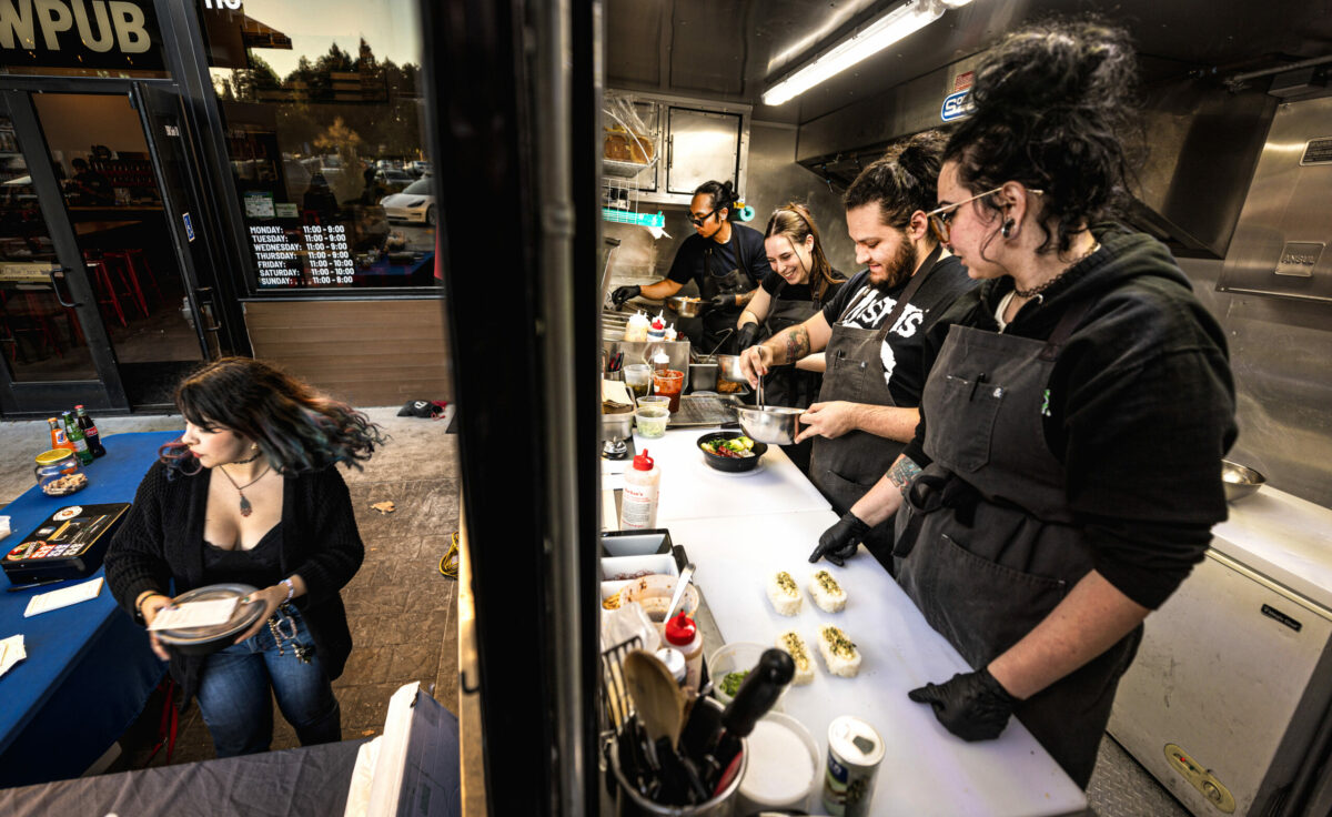 The team from the Shokakko food truck serves up their take on Asian street food on their regular Thursday night visit Jan. 23, 2025 at Old Caz Beer in Rohnert Park. (John Burgess / The Press Democrat)