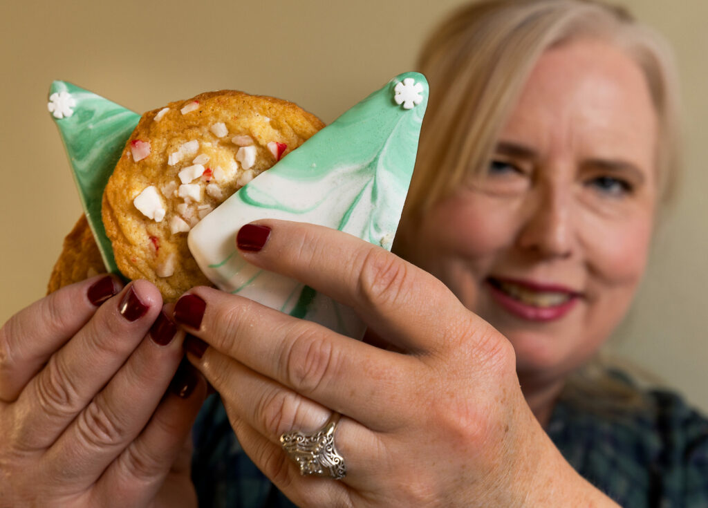 Michele Wimborough, owner of Hazel restaurant in Occidental, with her Marbled Sugar Cookie Trees and Peppermint White Chocolate cookies Tuesday, Dec. 13, 2022. (John Burgess/The Press Democrat)