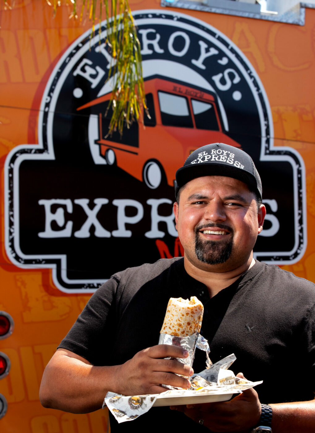 Owner Roy Cabrera gets ready to eat one of his own super burritos at El Roy’s Express Mex truck No. 2 on Santa Rosa Avenue in Santa Rosa, on Thursday, July 11, 2024. (Darryl Bush / For The Press Democrat)