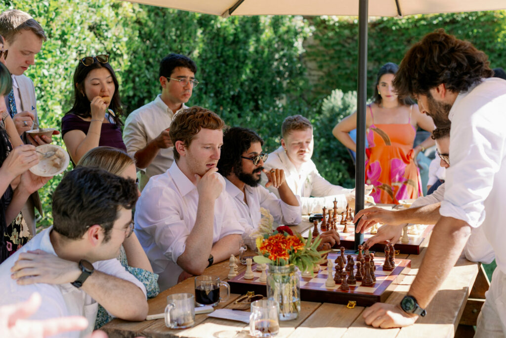 The 60 guests at Jason and Dylan's wedding embraced the garden party vision, playing chess and bocce and dancing a traditional hora on the grand lawn next to a grove of redwood trees. (Kathryn White)