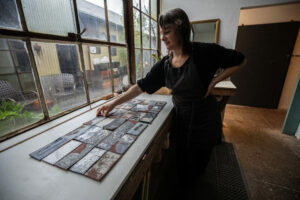 Kala Stein is a ceramics artist and teacher based in Sonoma representing issues of climate and weather in her work. Last year, she did a large installation of an atmospheric river storm in a series of clay tiles. Part of her process includes using rain water representing the weather effects in the glaze. (Chad Surmick / The Press Democrat)