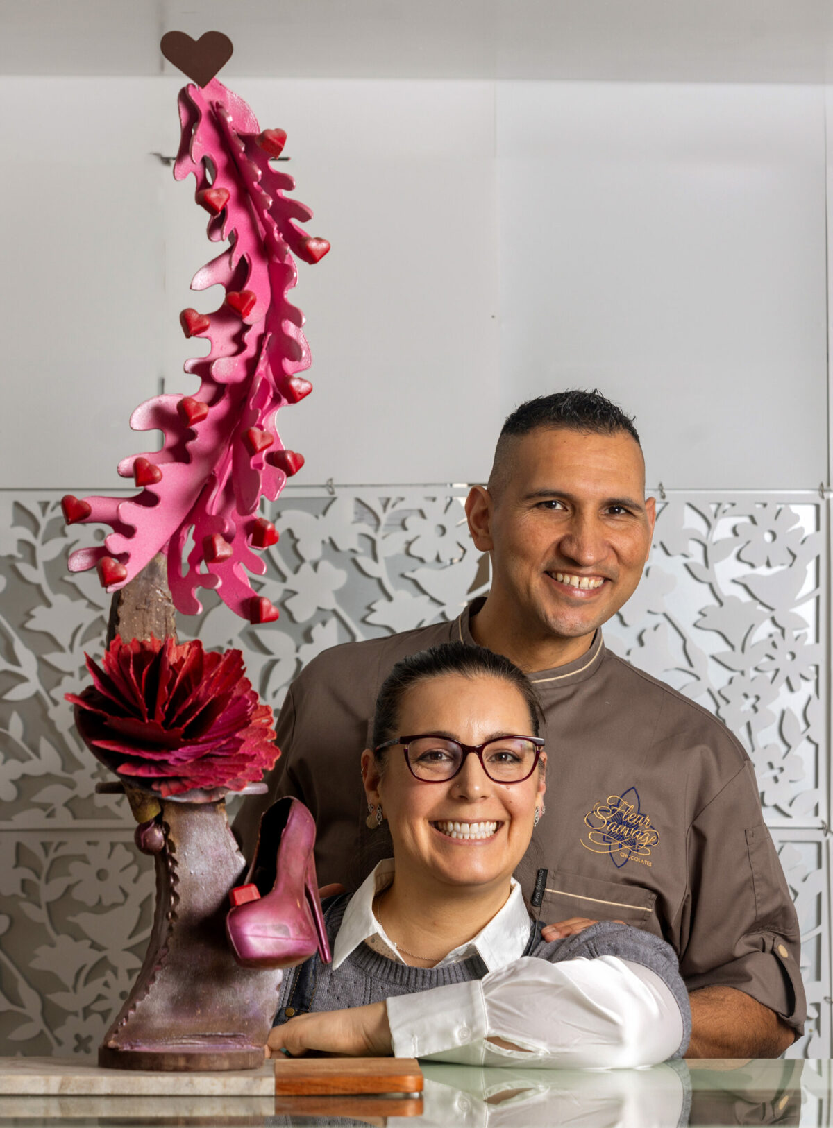 Robert and Tara Nieto, owners of Fleur Sauvage Chocolate with a chocolate Valentine’s Day sculpture, Tuesday, Jan. 16, 2024, in Windsor. (John Burgess / The Press Democrat)