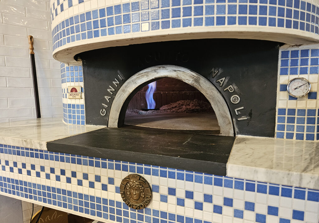 The imported wood-fired oven (which also can use gas) has stone from Mt. Vesuvius incorporated into its design. (Heather Irwin / Sonoma Magazine)