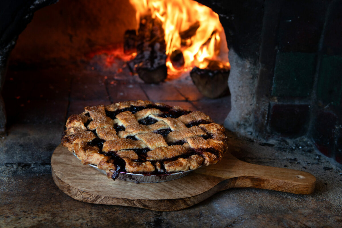 A Blueberry Lattice pie stays warm near the oven at Hazel Restaurant in Occidental, Friday, January 24, 2025. Pies at Hazel are baked once a week every Friday. (Darryl Bush / For The Press Democrat)