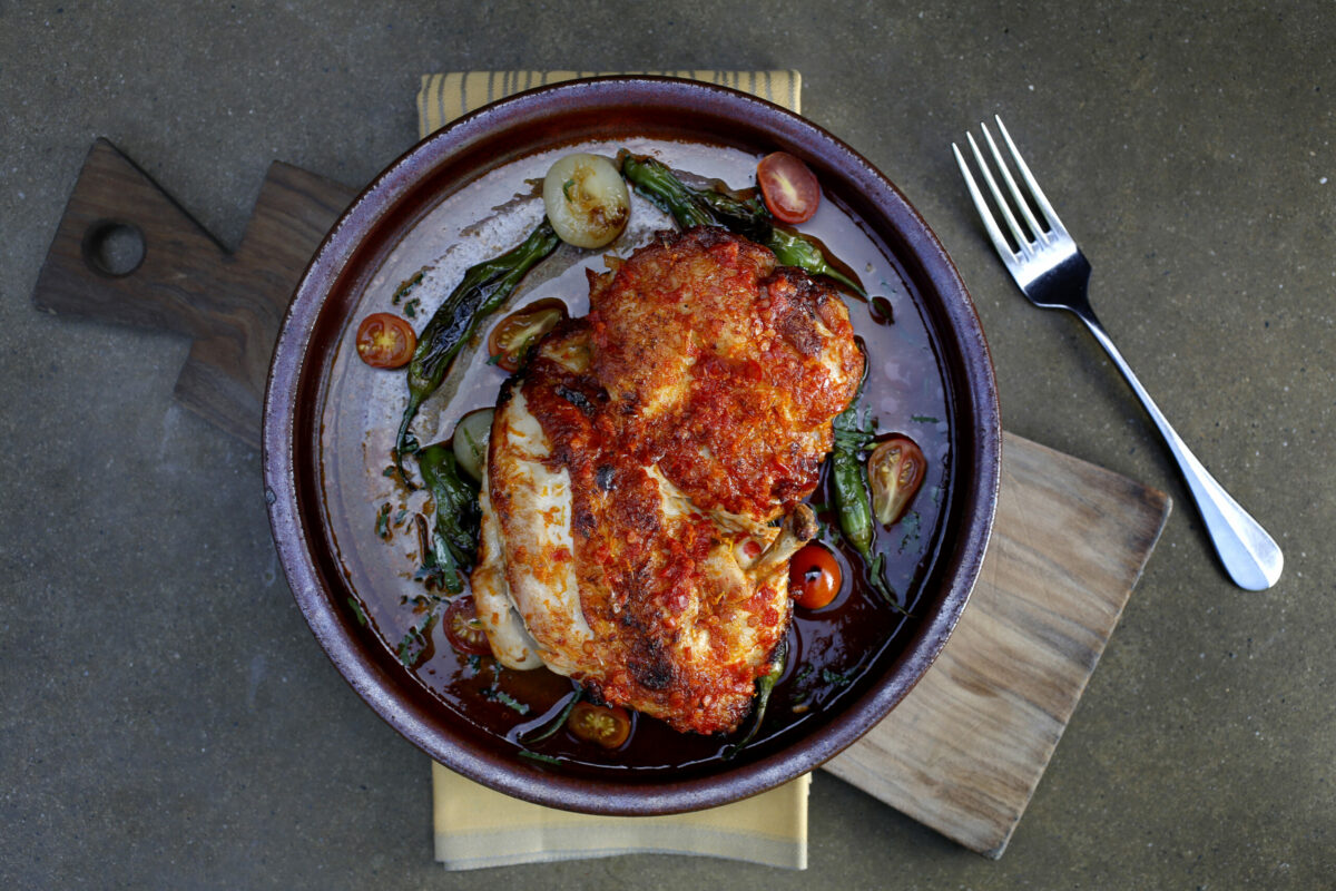 Pollo alla Diavola sul Mattone, Calabrian marinated chicken with roasted Shishito peppers and cipollini onions at Bottega on Monday, May 11, 2015, in Yountville. (Beth Schlanker / The Press Democrat)