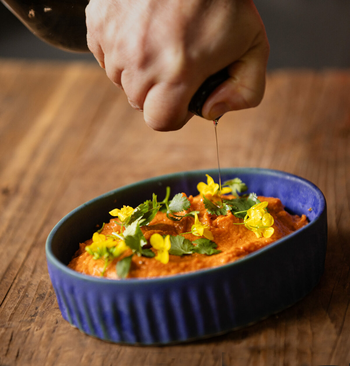 Carrot Hummus with a drizzle of olive oil from chef Liza Hinman, owner of the Spinster Sisters restaurant in Santa Rosa, Thursday, Feb. 22, 2024. Hinman’s restaurant, Santa Rosa’s Spinster Sisters, recently received a "Snail of Approval" from Slow Food. (John Burgess / The Press Democrat)