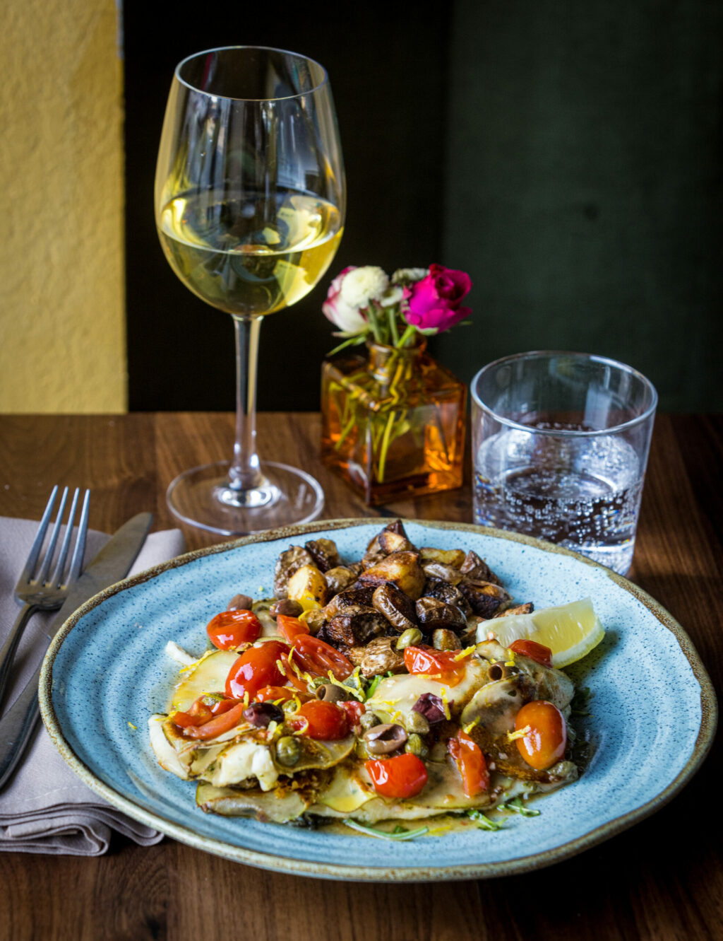 Branzino in Crosta, grilled potato wrapped sea bass with cherry tomatoes in a lemon white wine sauce from L'Oro di Napoli Friday, February 28, 2025, in Petaluma. (John Burgess / The Press Democrat)