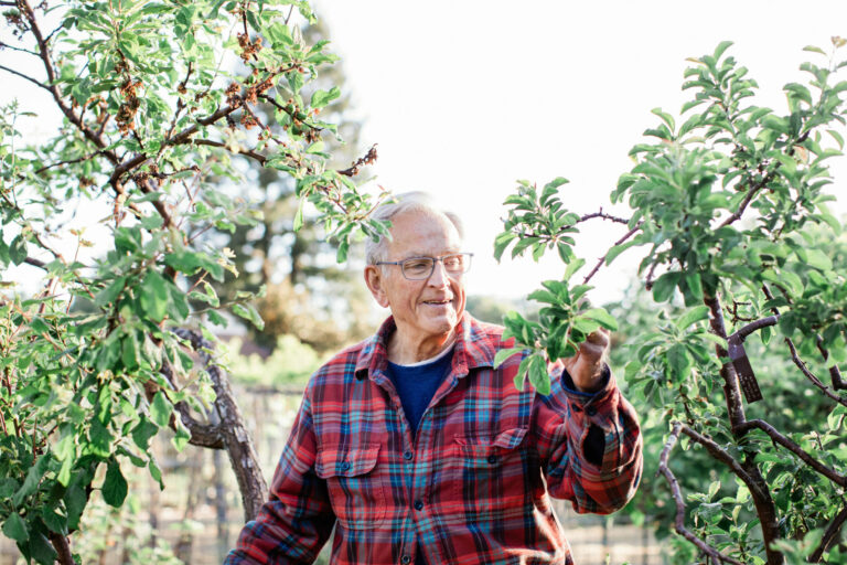 Rare fruit grower David Ulmer in the Sebastopol orchard he calls “Ulmer’s Acre.” (Eileen Roche / Sonoma Magazine)