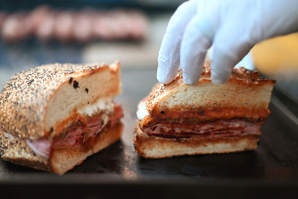 A classic muffuletta sandwich by Bayou On The Bay during the Petaluma Music Festival's 11th annual Mardi Gras Party at Lagunitas Brewing Co. Taproom and Sanctuary in Petaluma Tuesday, March 4, 2025. (Erik Castro / For The Press Democrat)