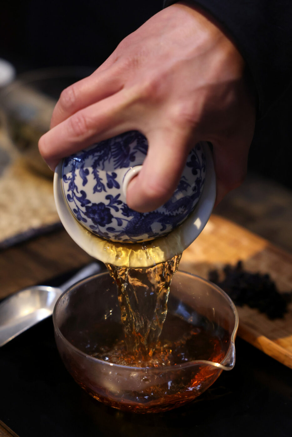 Owner Adrian Chang pours freshly steeped Mae Salong Kindred Oolong tea at Two Trees Tea House in Occidental Wednesday, Feb. 12, 2025. (Beth Schlanker / The Press Democrat)